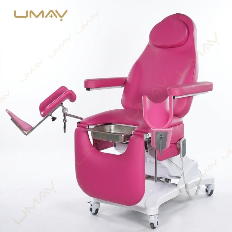 Pink electric gynecological examination chair isolated on a white background with stirrups and stainless steel tray.