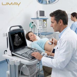 Physician performing an abdominal ultrasound scan on a patient using a cart-mounted portable machine.