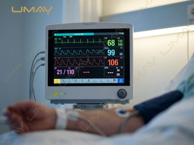 Multi-parameter patient monitor displaying ECG waveforms, heart rate, SpO2, and blood pressure readings.